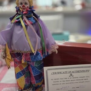 Dynasty Doll Colorful Harlequin Porcelain Clown Doll in Lavender Outfit
